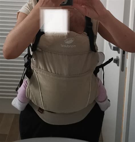 Dieťa v ergonomickom nosiči Manduca