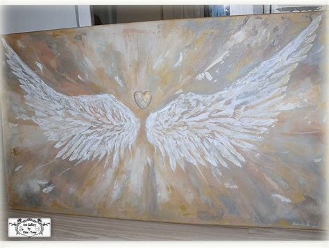 Obraz anjela držiacho malé dieťa