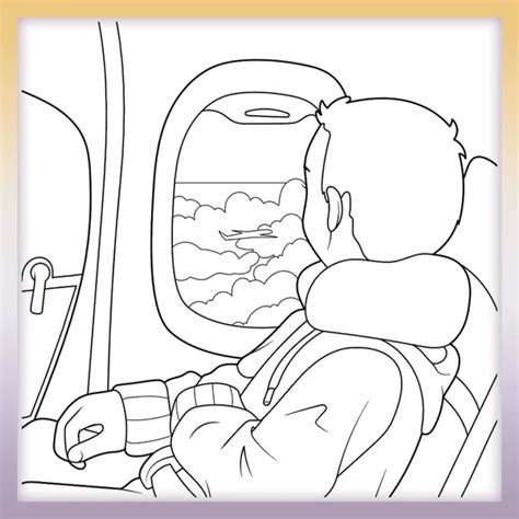 Chlapec vyfarbuje omaľovanku s traktorom