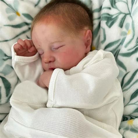 Ilustrácia bábätka s textilnou knižkou